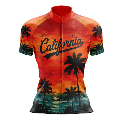 A short-sleeve cycling jersey with a full front zipper, featuring a California sunset and palm tree graphic print. The design includes a red and orange sky, black palm tree silhouettes, and a teal ocean scene at the bottom.